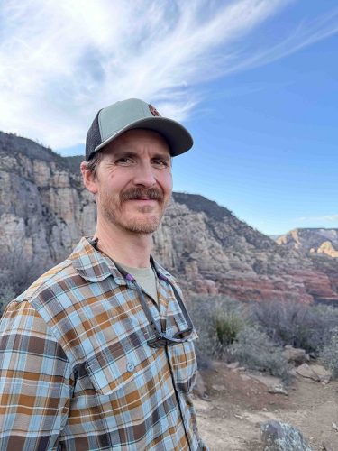 Western New Mexico University Assistant Professor Caleb Loughran, Ph.D., whose rattlesnake research explores survival and social behavior.