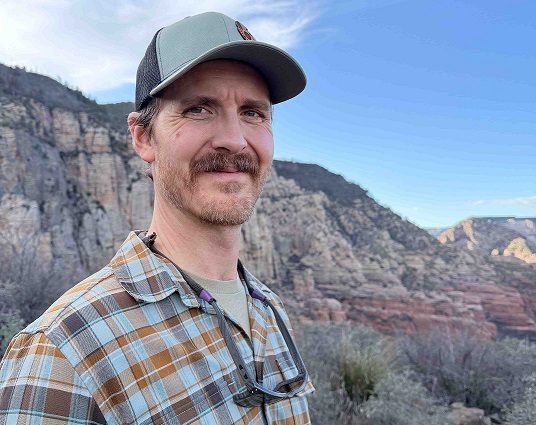 Western New Mexico University Assistant Professor Caleb Loughran, Ph.D., whose rattlesnake research explores survival and social behavior.