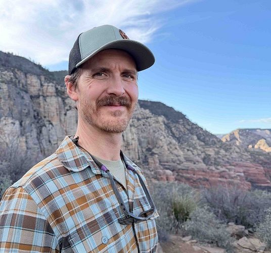 Western New Mexico University Assistant Professor Caleb Loughran, Ph.D., whose rattlesnake research explores survival and social behavior.