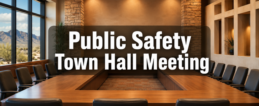 Empty civic meeting room with the words “Public Safety Town Hall Meeting.”