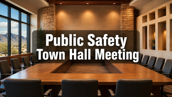 Empty civic meeting room with the words “Public Safety Town Hall Meeting.”