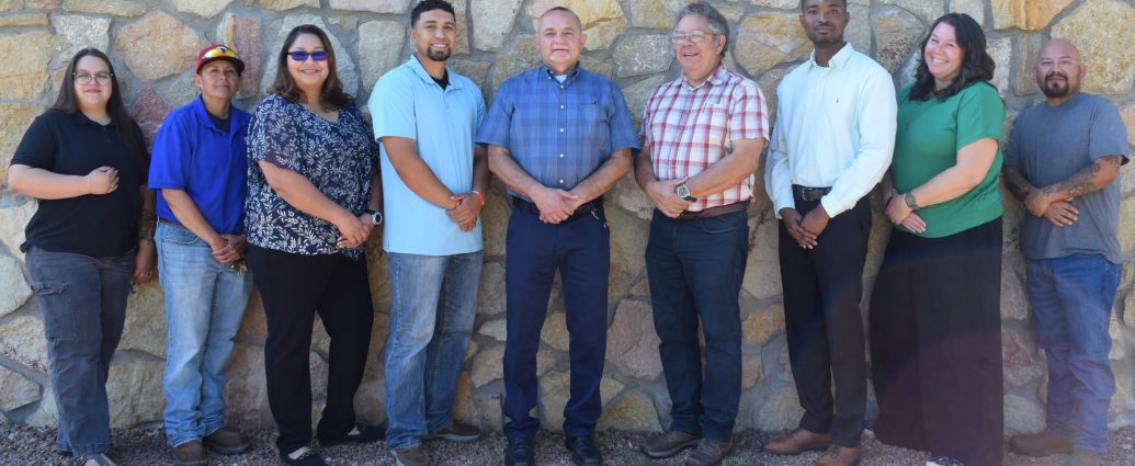 Nine new Doña Ana County employees pose together for a welcome photo. Description: Keeping Cruces Connected. Nine new Doña Ana County employees pose together after joining county departments including the Clerk’s Office, Facilities and Services, Community Development, Engineering and Roads, Jetport and Legal. Slug: dona-ana-county-welcomes-new-employees Image Credit: Doña Ana County