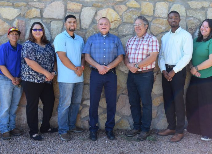 Nine new Doña Ana County employees pose together for a welcome photo. Description: Keeping Cruces Connected. Nine new Doña Ana County employees pose together after joining county departments including the Clerk’s Office, Facilities and Services, Community Development, Engineering and Roads, Jetport and Legal. Slug: dona-ana-county-welcomes-new-employees Image Credit: Doña Ana County