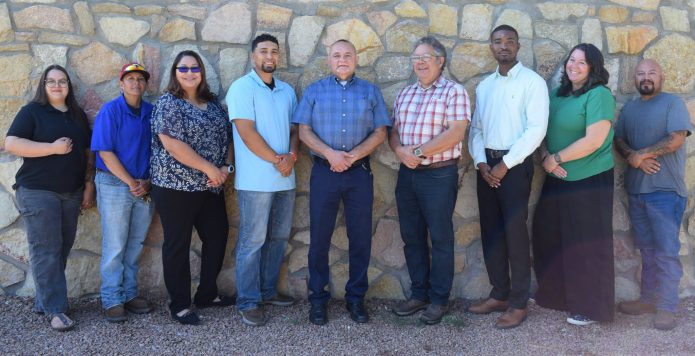 Nine new Doña Ana County employees pose together for a welcome photo. Description: Keeping Cruces Connected. Nine new Doña Ana County employees pose together after joining county departments including the Clerk’s Office, Facilities and Services, Community Development, Engineering and Roads, Jetport and Legal. Slug: dona-ana-county-welcomes-new-employees Image Credit: Doña Ana County