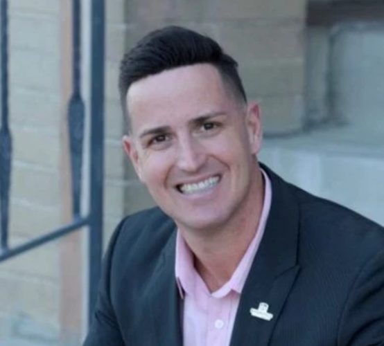 Scott Andrews, former Doña Ana County Manager, smiling in a portrait photo.