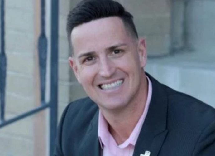 Scott Andrews, former Doña Ana County Manager, smiling in a portrait photo.