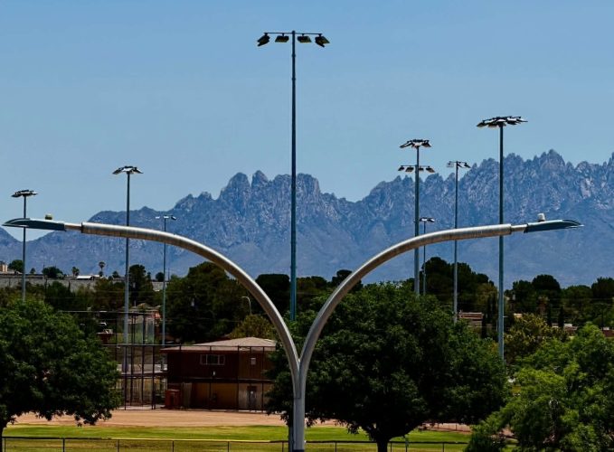 Street lights in Las Cruces with the Organ Mountains in the background.