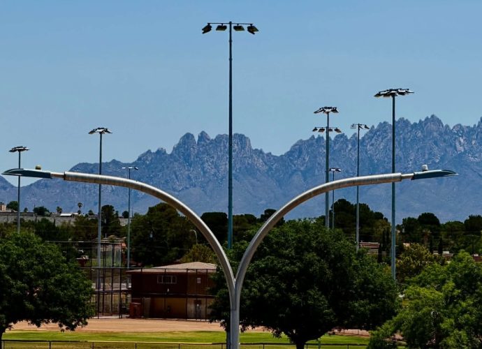 Street lights in Las Cruces with the Organ Mountains in the background.