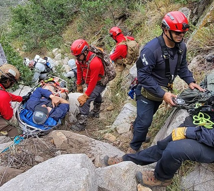 Search and rescue personnel assist an injured hiker in the Organ Mountains near Aguirre Springs.