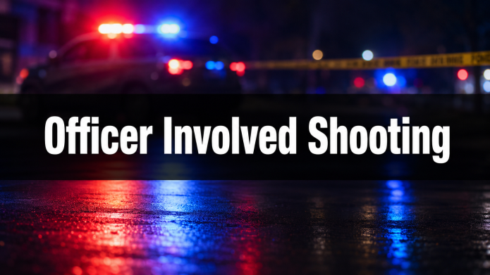 Blurred red and blue law-enforcement lights with yellow scene tape and the words “Officer Involved Shooting.”