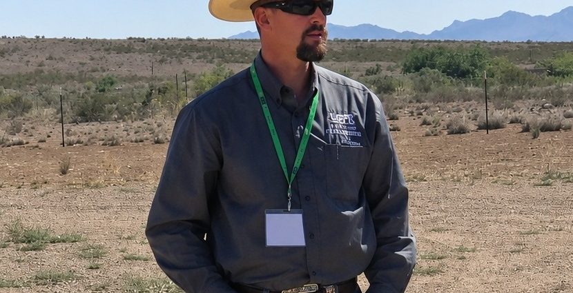 Russell Johnson, president of the Luna County Farm and Livestock Bureau, stands in the New Mexico desert during a public meeting discussing concerns over federal groundwater wells associated with border wall construction.