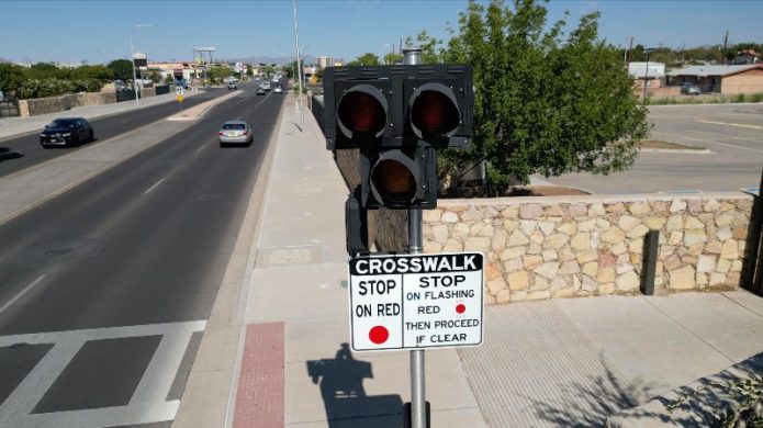 HAWK pedestrian crossing signal along a multi-lane roadway in Las Cruces