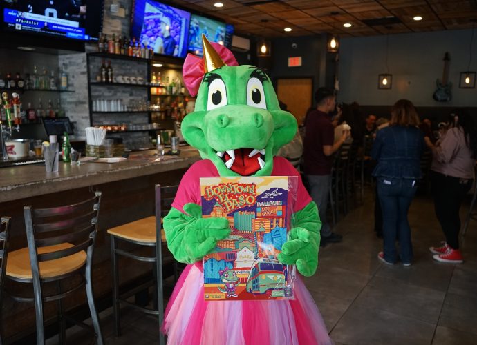 Sally the Alligator holds birthday treats during Downtown Employee Appreciation Day in El Paso.