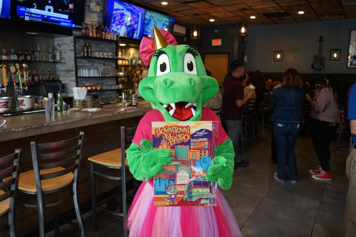 Sally the Alligator holds birthday treats during Downtown Employee Appreciation Day in El Paso.