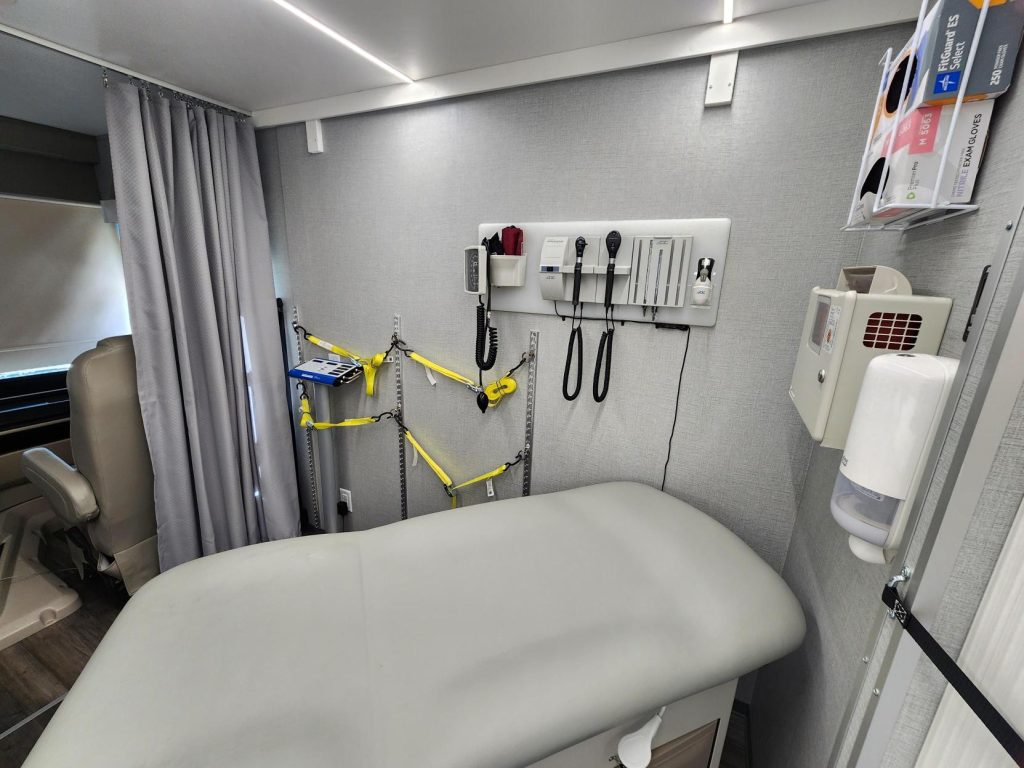 Inside Presbyterian Mobile Health Unit providing free biometric screenings at DACC in Las Cruces